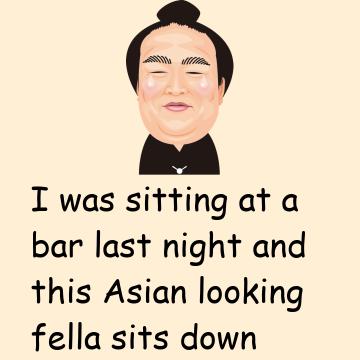 A Man Sitting At A Bar